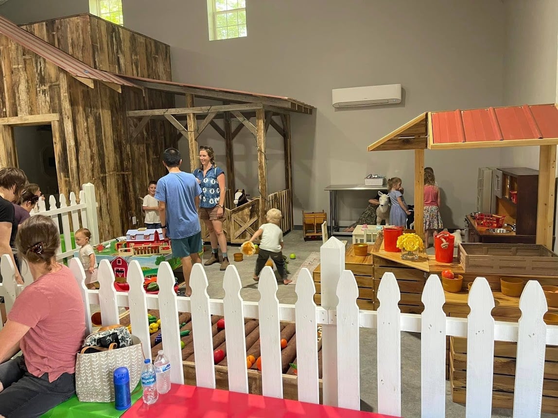 Families playing in the Imagination Station